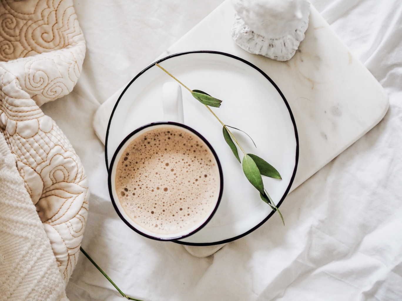 A cup of tea on a plate, minimalist wellness routine