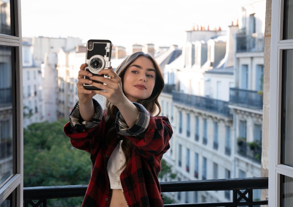 Emily in Paris taking a selfie